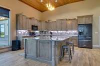 The large, stylish kitchen with custom cabinetry is both ultra-functional and beautiful.