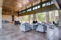 One of the most impressive outdoor spaces is this 2-story high resort-styled breezeway which connects the main house to the office wing.  Relax in the shade while enjoying more amazing views of the lake from here.