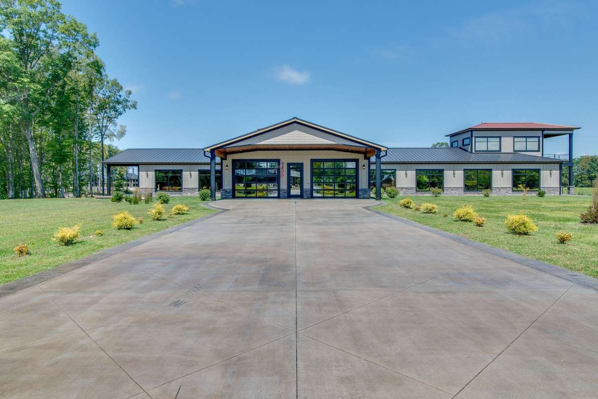 Toward the front of the property near the entrance is the guest/office house.
