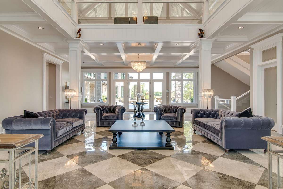 From the two-story high walls of windows to the marble floors to the intricate hand-formed woodwork, you are surrounded by splendid details.