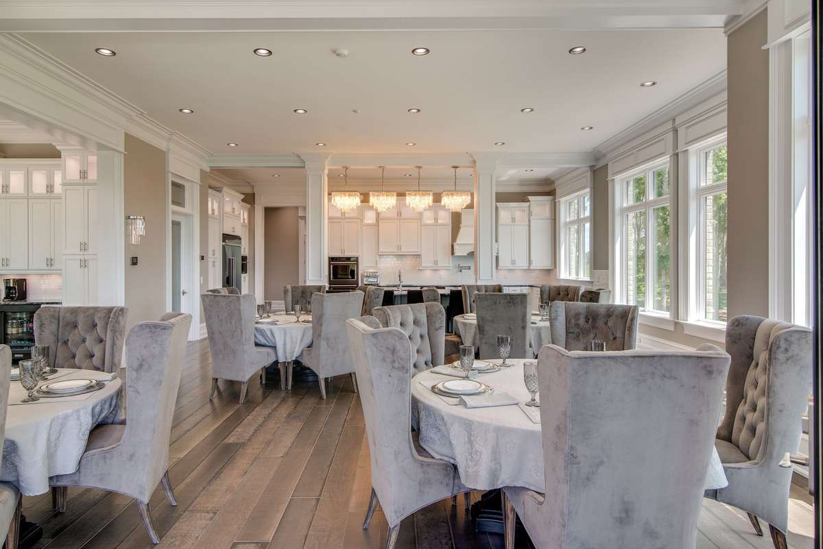 There's room for several tables in the main-level dining room.  Imagine hosting incredible events in this stunning home.