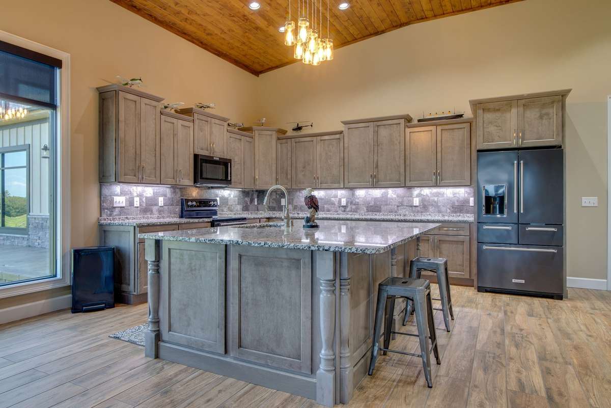 The large, stylish kitchen with custom cabinetry is both ultra-functional and beautiful.