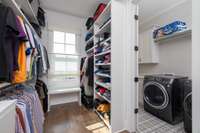 Primary closet with walk-through to laundry