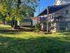 View of the back porch.  Notice the shed.  It will remain with the home.