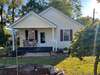 Front view of this charming 2 bedroom home.  New metal roof, vinyl siding, and windows were added in 2010.