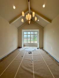 Primary Bedroom with vaulted ceiling, sitting area, located on the rear of the home for extra privacy  *this home is under construction  Photo updated: 4/4/24