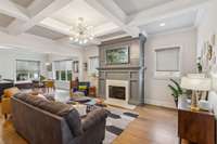 Open living area is super warm and inviting, soaring 10' coffered ceiling & beautiful fireplace with remote controlled gas logs.