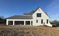 Side view of house with a 4 - Car Garage  *this house is under construction Photo taken 3/17/24