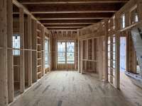 Study on main level with fireplace, french doors and lots of natural light  *this homes is under construction  Photo taken 1/8/24