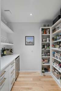 Sellers built out a custom bar and pantry featuring generous storage and wine fridge.