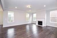 Spacious Great Room with lots of natural light. Photo is of a similar floorplan, not actual home.