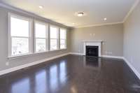 Great Room with lots of natural light and optional Fireplace. Photo is of a similar floorplan, not actual home.