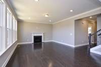 Great Room with lots of natural light and optional Fireplace. Photo is of a similar floorplan, not actual home.