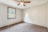 Bedroom #2 has brand new carpet, ceiling fan, trim, and blinds.