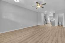 Large living space downstairs. (This home is similar to the home under construction. Selections may vary, please see listing media for details).