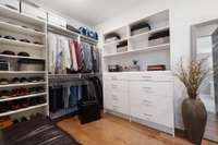 Dual closets in the primary bedroom are quite a highlight of this pristine home! Custom closet systems offer easy organization and room for even the largest of wardrobes!