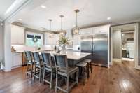 This kitchen is both a chef’s and entertainer’s dream! A built in refrigerator and freezer has ample space for all of your groceries.