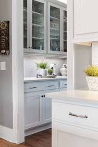 The butler’s pantry provides additional storage your barware or extra room for preparing for company!