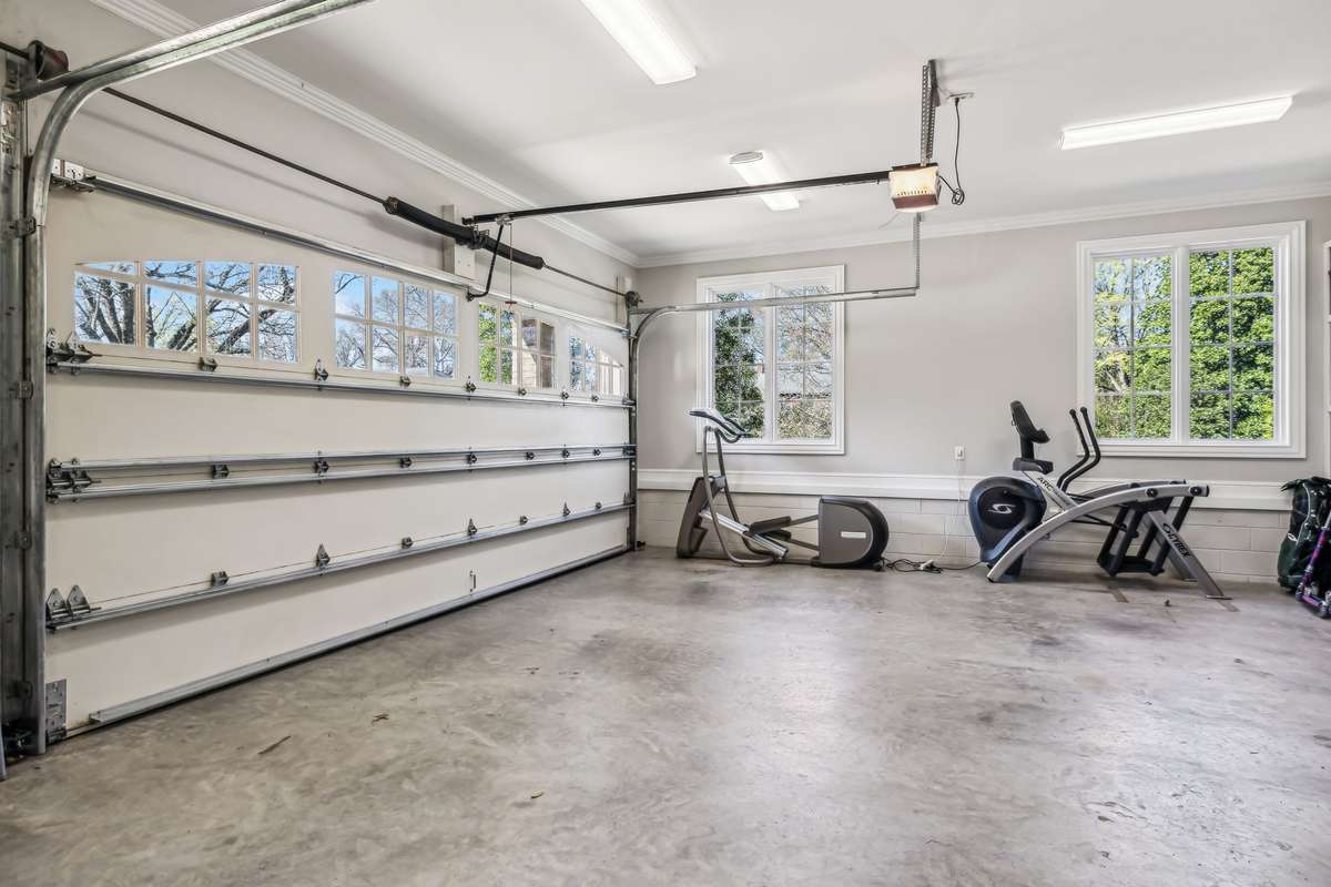 The expansive 4-car garage offers abundant space to accommodate family vehicles, bicycles, lawn equipment, and much more.