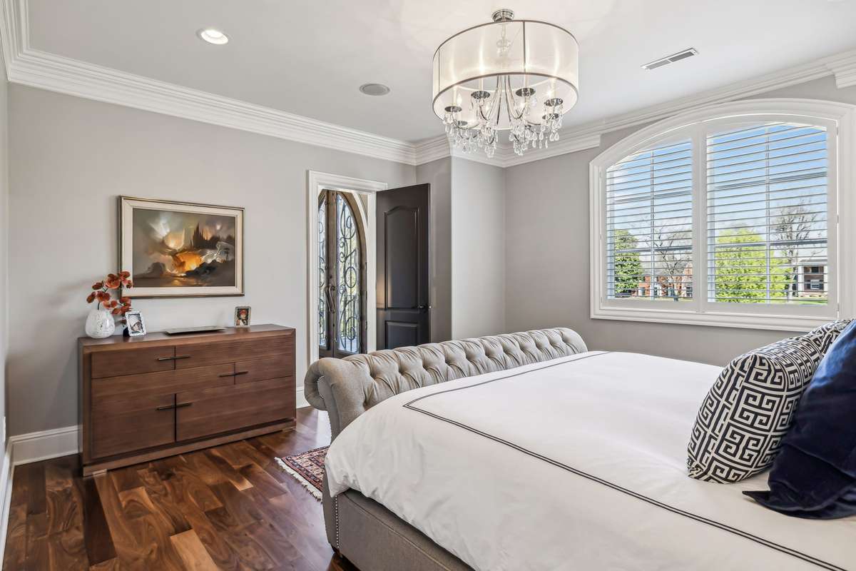 The room also includes a private bath for your guests' relaxation and a charming seating area overlooks the Grand Foyer, and a private balcony offers breathtaking views framed by stunning iron and wood cathedral-style doors.