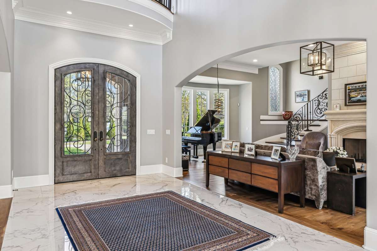 Every detail has been thoughtfully curated - from the intricate baseboards and crown molding to the subtle ceiling accents, integrated sound system, and artfully placed recessed lighting—creating an atmosphere that’s both luxurious and inviting.