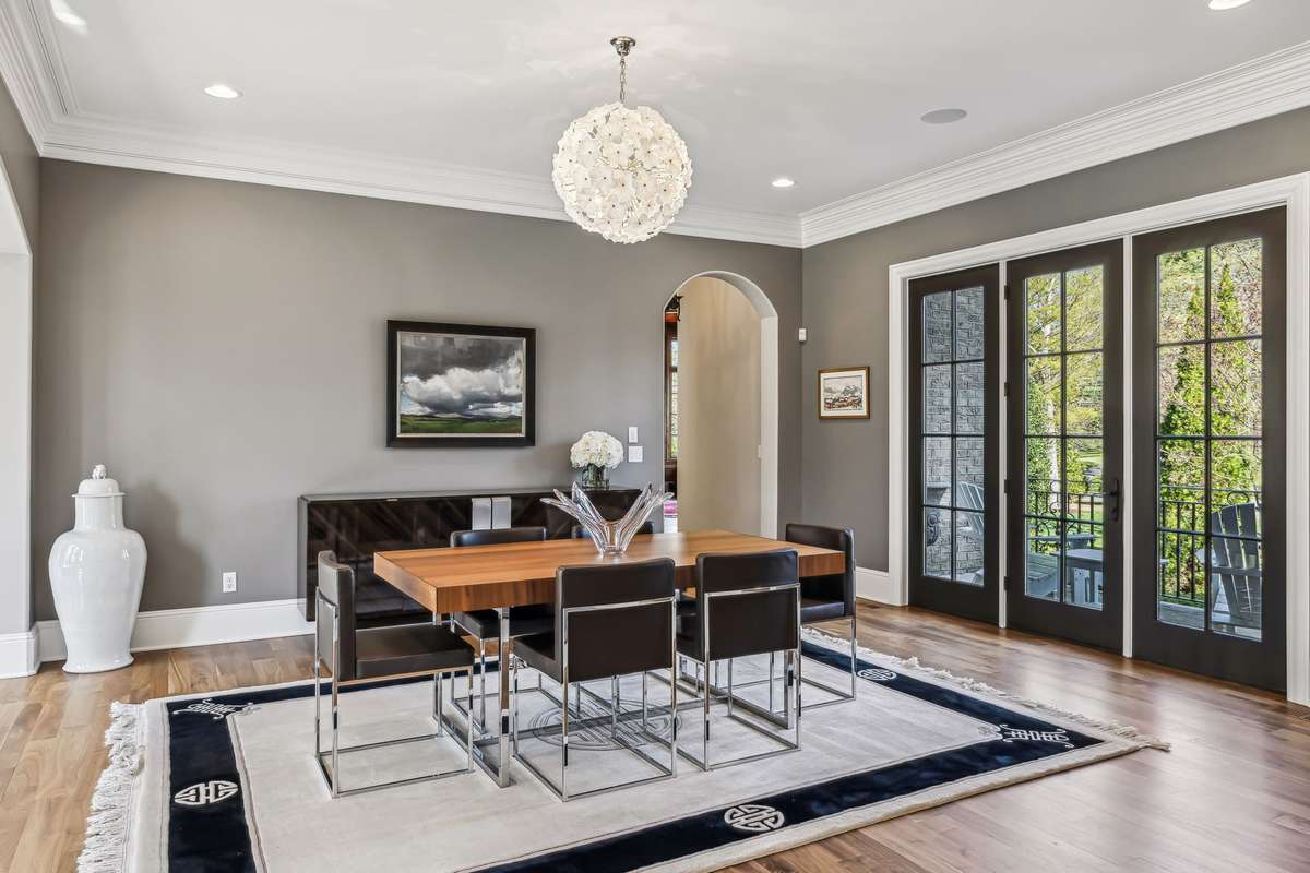 Perfectly positioned just off the Grand Foyer and opposite the Formal Living Room, this sophisticated space is graced by an arched doorway and recessed lighting. Note: Chandelier does not remain.