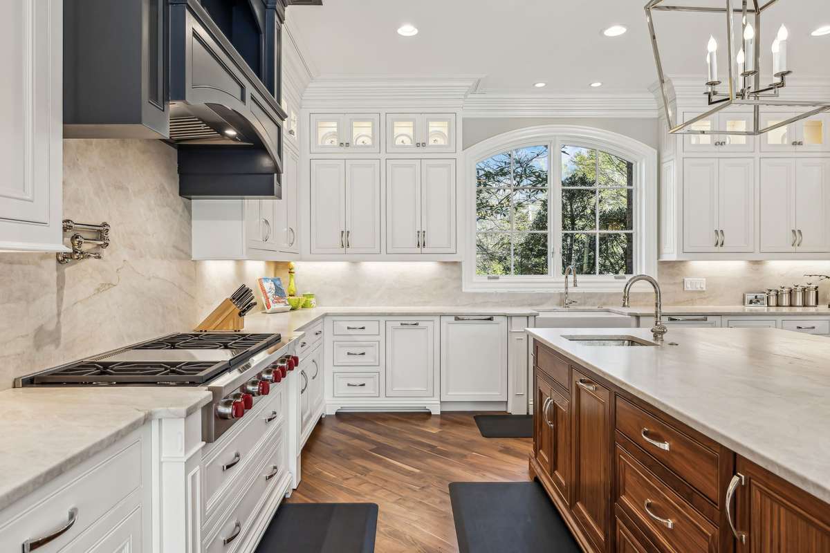 Custom cabinetry, complete with soft-close drawers and Rev-A-Shelf inserts, ensures that every item has its place.
