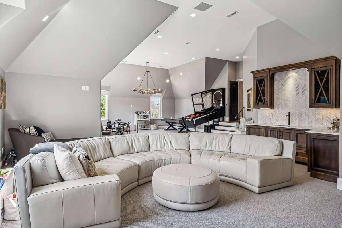 Grab a tub of popcorn and settle in—this well-appointed Bonus Room is the ultimate entertainment haven.