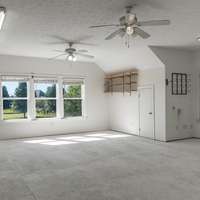 Open heated and cooled space above detached garage.  Perfect for an office, man cave or apartment