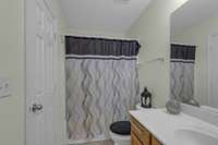 The owners’ bath with shower and tub combo.