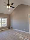 Living Room with Vault Ceiling and Ceiling Fan