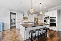 A large kitchen island is truly a must these days. Not only is it a great area to gather and eat, but the additional storage under the island is also an understated feature.