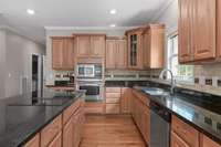 This is a  great  kitchen -  it features a large  walk-in pantry, a large  island with seating and granite counters.