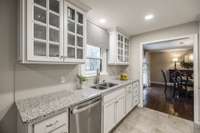 A tile backsplash not only serves a functional purpose by protecting the walls from splashes but also contributes to the kitchen's aesthetic appeal. It's a decorative element that ties the room together.