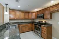 Beautiful Cabinetry, dishwasher, microwave, and stove are Stainless Steel