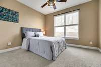 Spacious and bright second bedroom on main level with full bathroom right beside it.