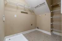 Large laundry room with pantry & extra storage space