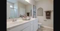 Stock photo of owner's bath with large shower and linen closet