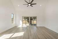 Living room also features sliding glass doors that lead to the covered patio