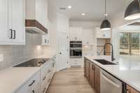 Kitchen has a pantry, and a built-in oven and microwave combo.