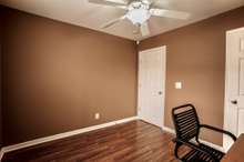 Bedroom 3 On Main Level With Laminate Flooring And Ceiling Fan