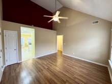 Great Room With Vaulted Ceiling With Access To Kitchen