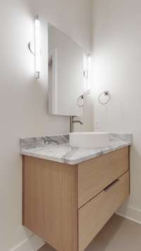 Bedrooms 2 & 3 custom floating vanity and vessel sink