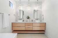 Primary Bathroom - custom white oak floating double vanity with soft close drawers, vessel sinks, and tile backsplash