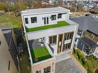 Two turf-covered rooftop decks for multi-level outdoor living