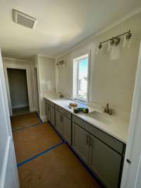 This is the Owner's bath with tons of cabinets/countertop space. Pictures are of another Leighland  floorplan in a different community, finishes may be different.