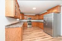 Spacious Eat-In Kitchen with Oak Cabinetry that can be painted or left natural! Stainless Steel appliances!