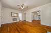 The living room is complete with ceiling fan and it connects through to the kitchen area.