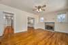 Just inside the front door you are greeted by this living room space complete with original hardwood floors and original fireplace.