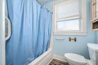 Tub/shower combo and a window in the primary bath.